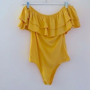 Cute goldy/yellow bodysuit never worn! no stains!